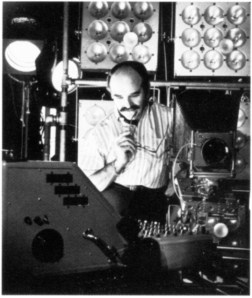 Lionel Freedman with strob equipmente units and a mobile lighting console that he designed and built for the studio, circa 1960s.