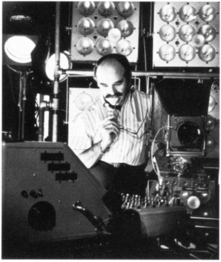 Lionel Freedman with strob equipmente units and a mobile lighting console that he designed and built for the studio, circa 1960s.